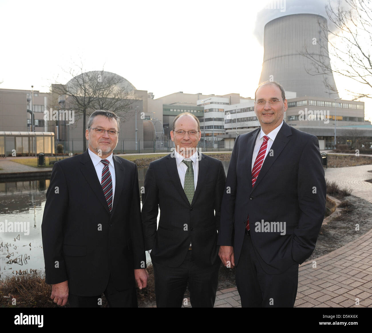 Chief of the atomic power plant Emsland, Juergen Haag (L-R), chief of the gas coal-fired RWE, Roger Miesen, and chief of the gas power station Emsland, Heinz-Juergen Wuellenweber, pose in front of a power plant after consultations in Lingen, Germany, 03 April 2013. Photo: Ingo Wagner Stock Photo