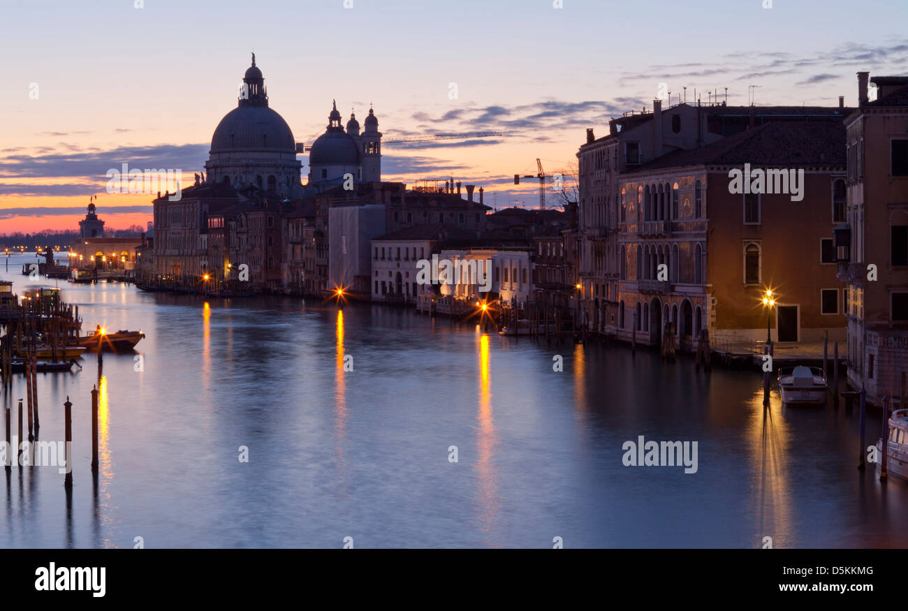 Looking east down the Grand Canal  view of the dome of Santa Maria della Salute church at sunset. Stock Photo