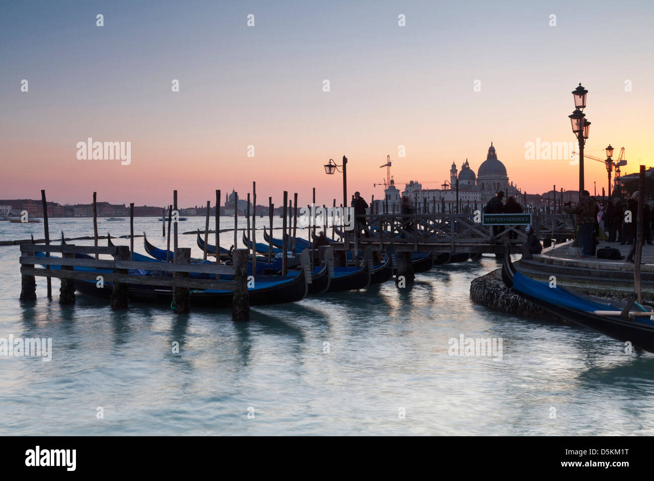 Venice at dusk city state Renaissance UNESCO world heritage site. Gondola boats moored on the water. Romantic scene. Stock Photo