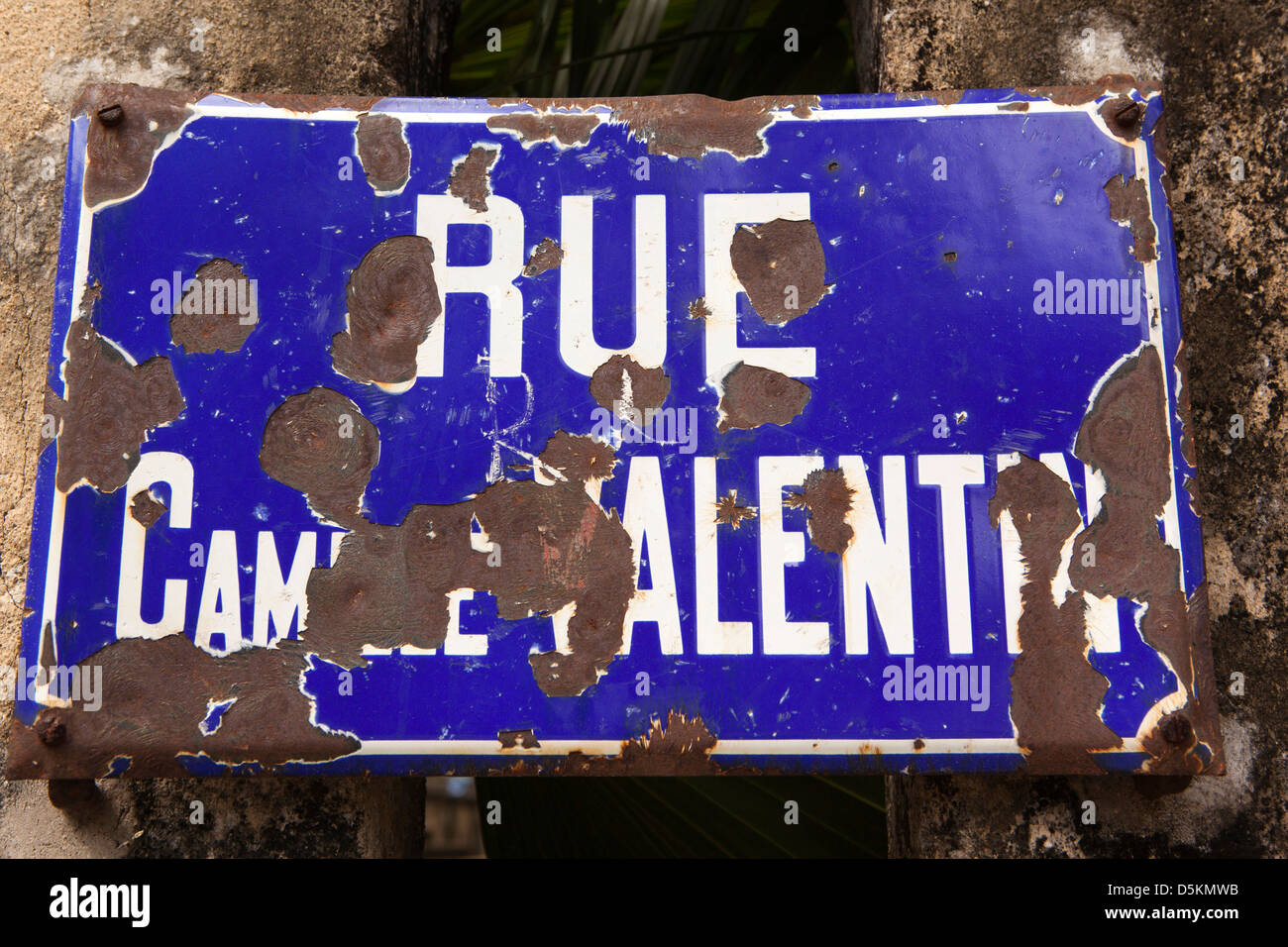 Madagascar, Nosy Be, Hell-Ville, Rue Camille Valentin chipped enamel French road name Stock Photo