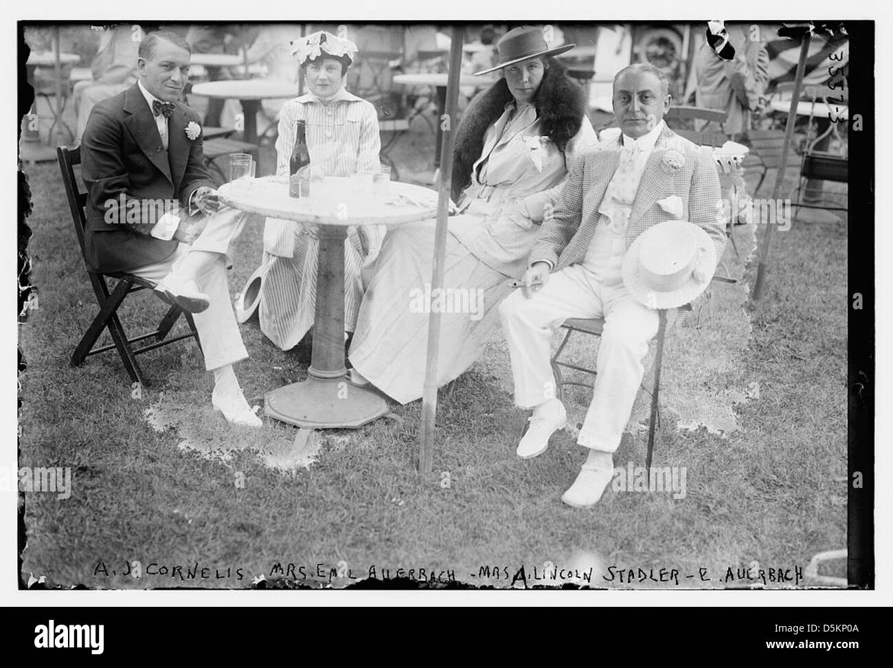 A photograph showing A.J. Cornelis, Mrs. Emil Auerbach, Mrs. A. Lincoln Stadler, and E. Auerbach seated together, part of a historical archive in the Library of Congress. Stock Photo