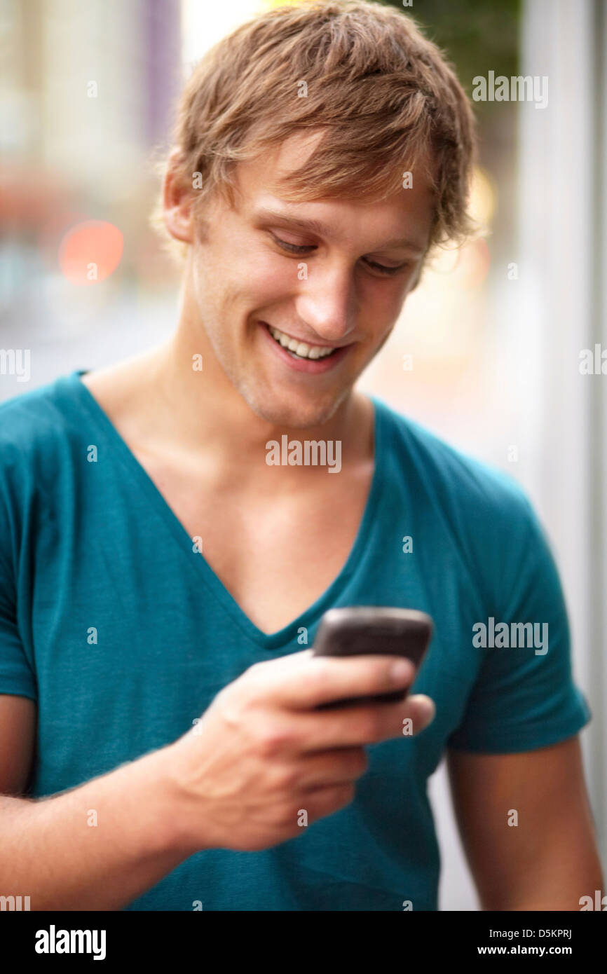 Foreground focus male using phone hi-res stock photography and images ...