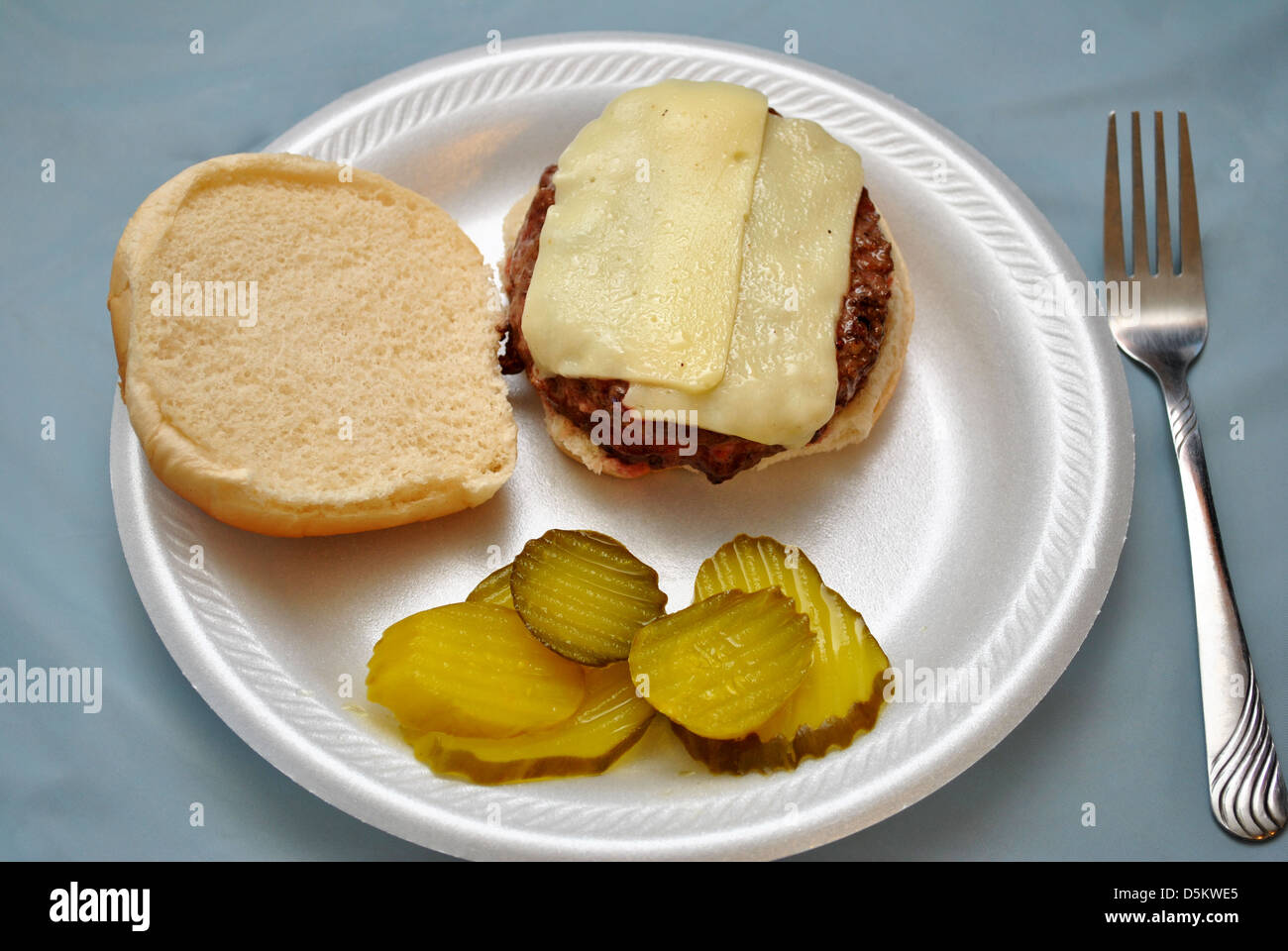 Tasty Burger with Pickle Chips Stock Photo