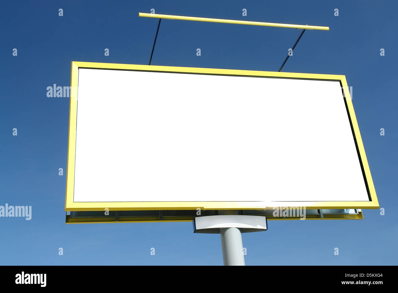 Large blank billboard on concrete pillar - against clear blue sky Stock Photo