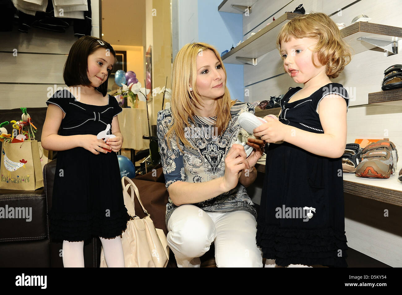 Ivana Gottova and her daughters Charlotte Ella and Nelly Sofie attend the opening of a Victoria Magic children's shoe store. Stock Photo