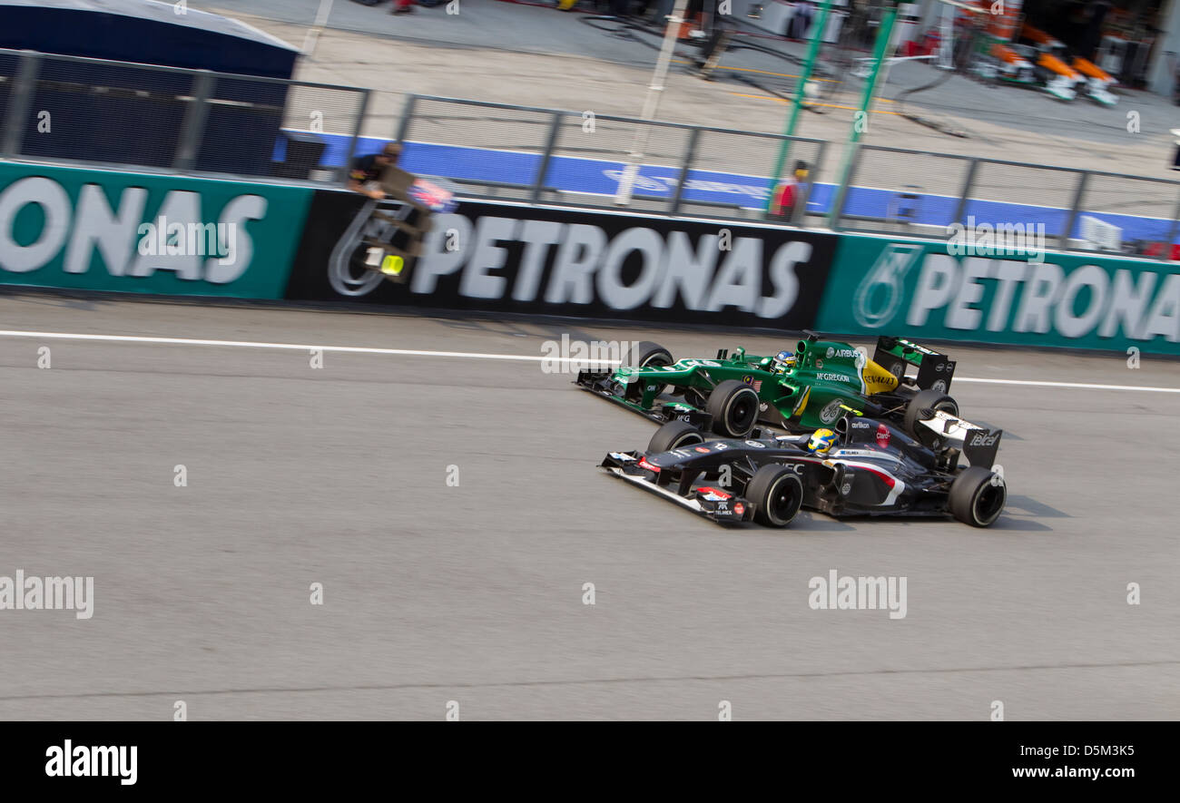 Caterham F1 team overtaken by Sauber Ferrari team at the main straight