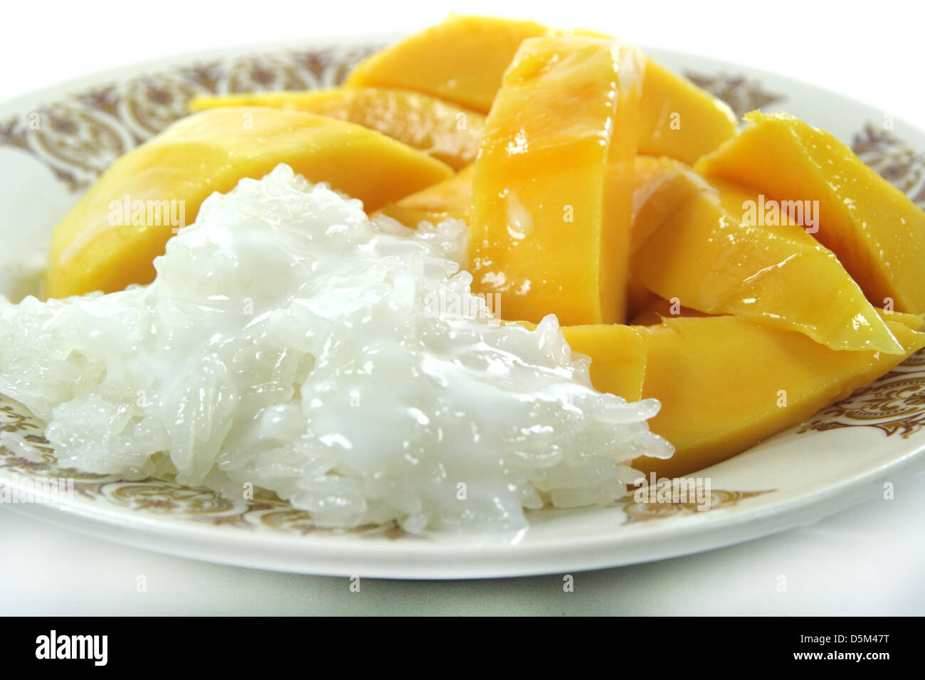 Thai Mango with Sticky Rice and Coconut Sauce Dessert Stock Photo Alamy