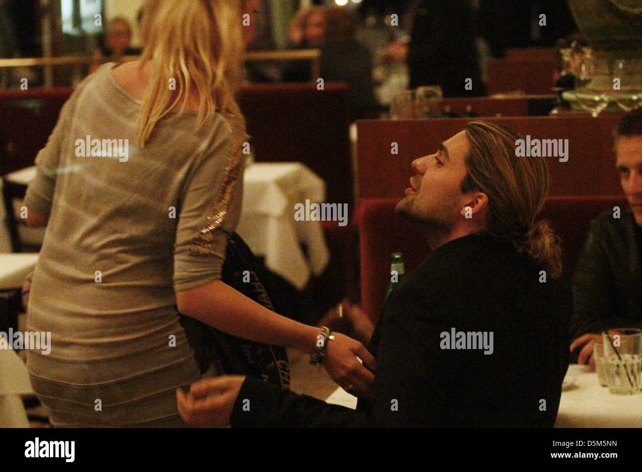 David Garrett and an unidentified female having dinner at Borchardt restaurant. Berlin, Germany - Stock Photo