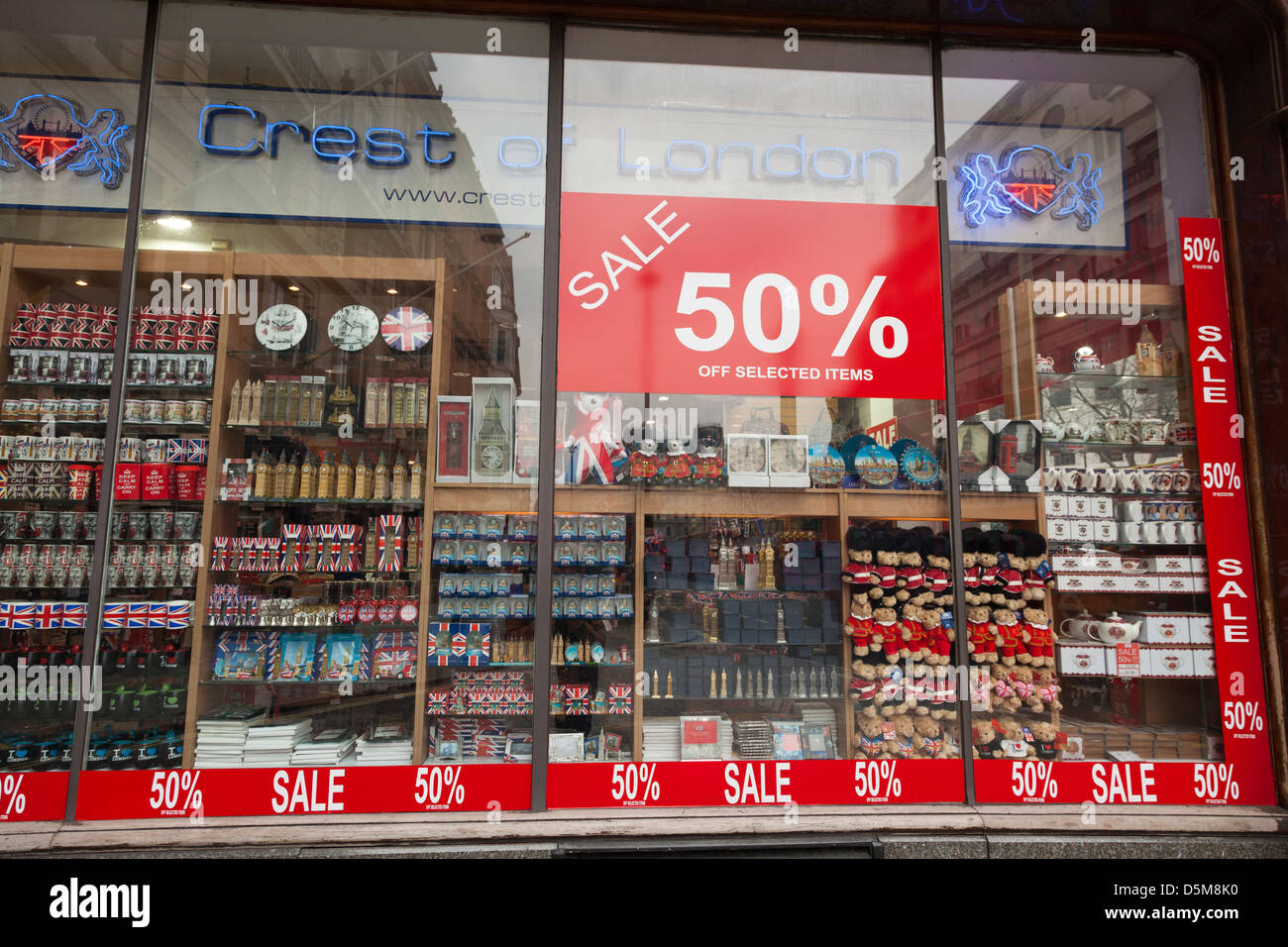 Tourist souvenirs in London shop window with 50% sale poster Stock Photo