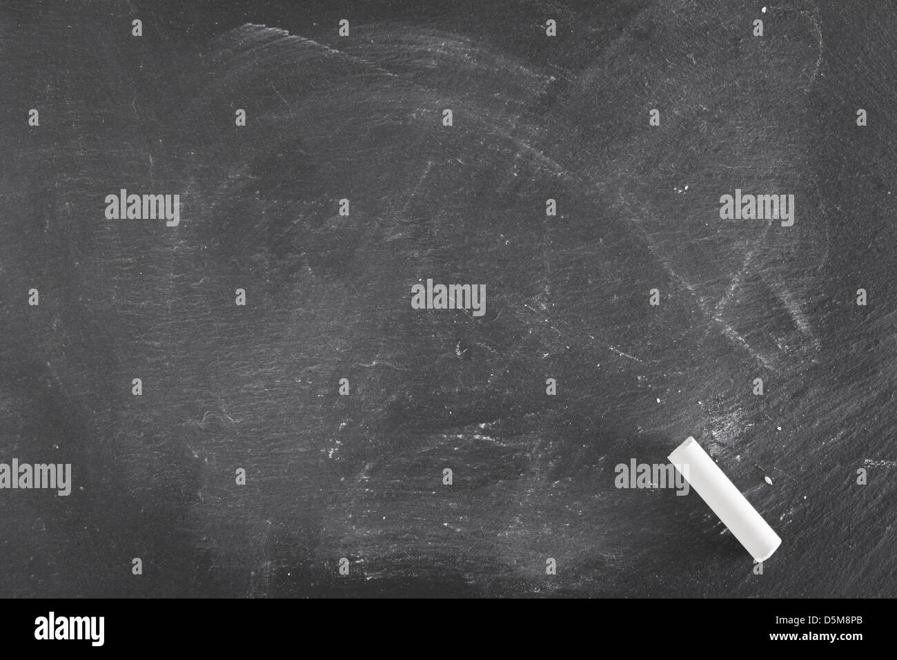 Background of a black board with single piece of chalk Stock Photo