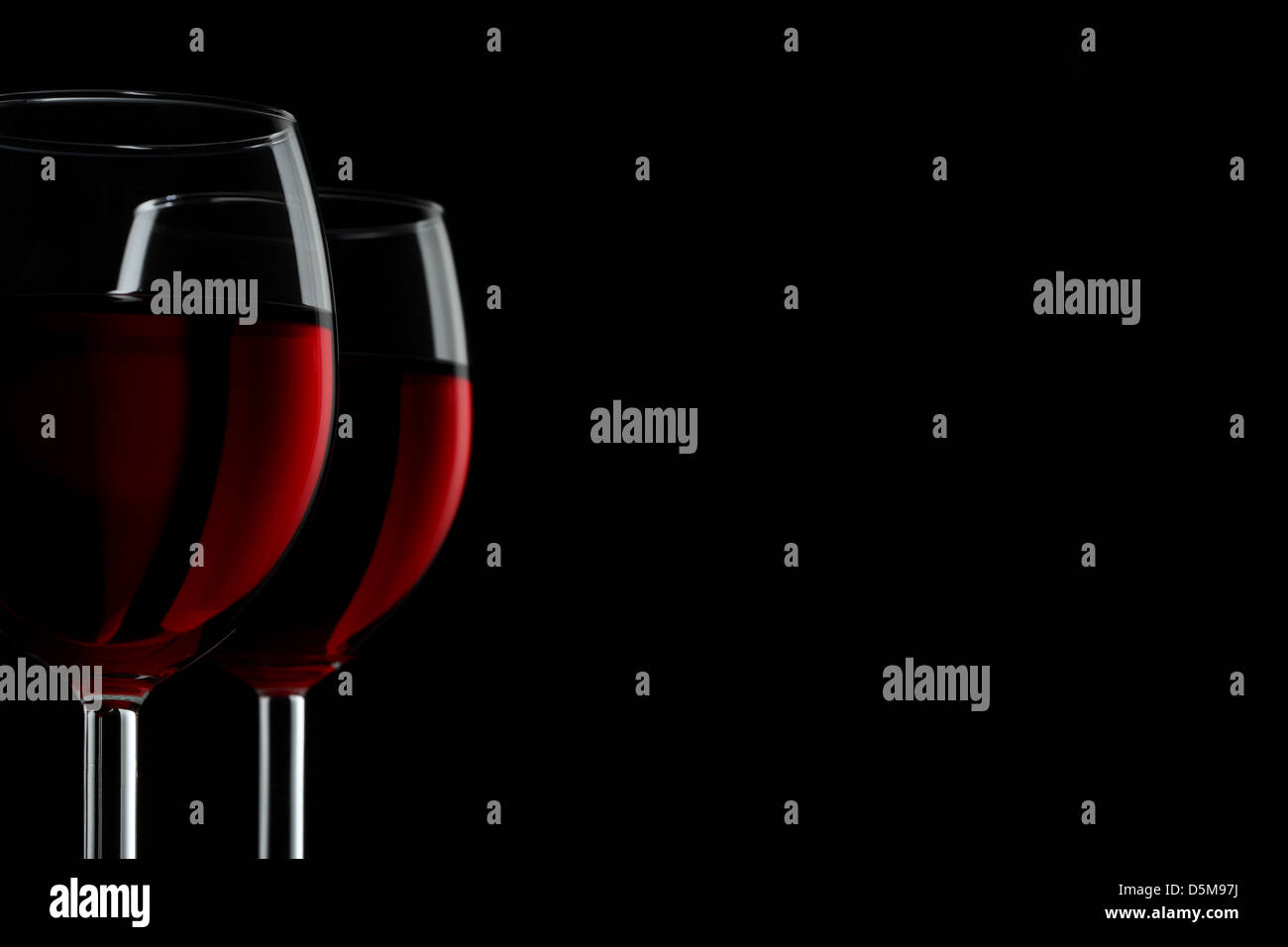 Two glassed of red wine isolated on black background Stock Photo