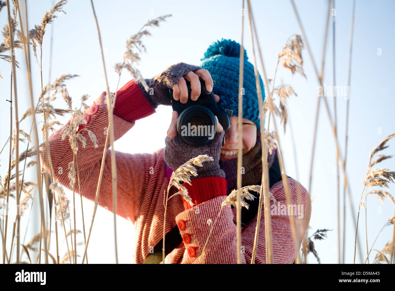 Young pretty woman taking nature pictures outdoors Stock Photo - Alamy