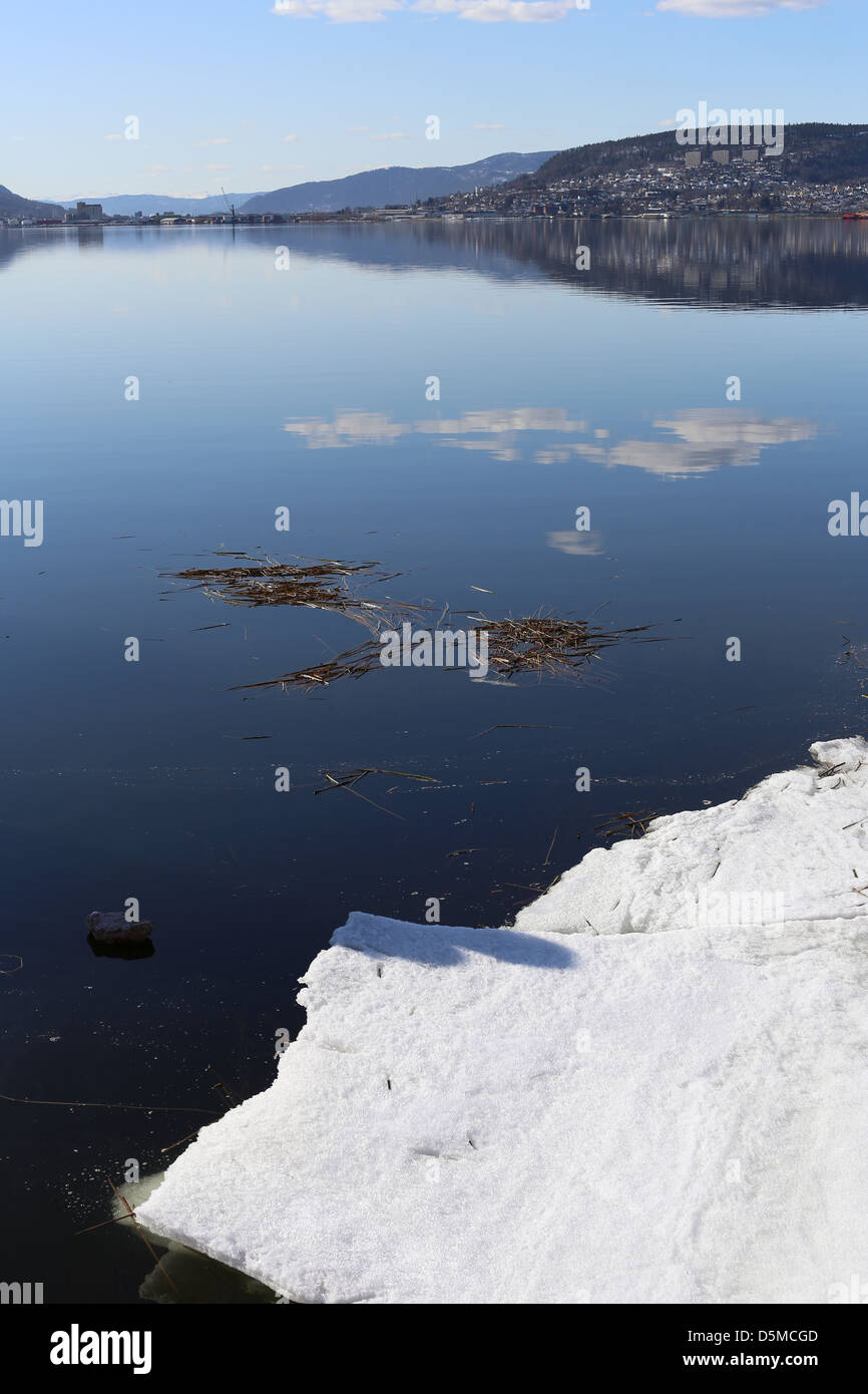 Reflections and ice in a Norwegian fjord, Drammensfjorden, Drammen, Norway, Europe Stock Photo