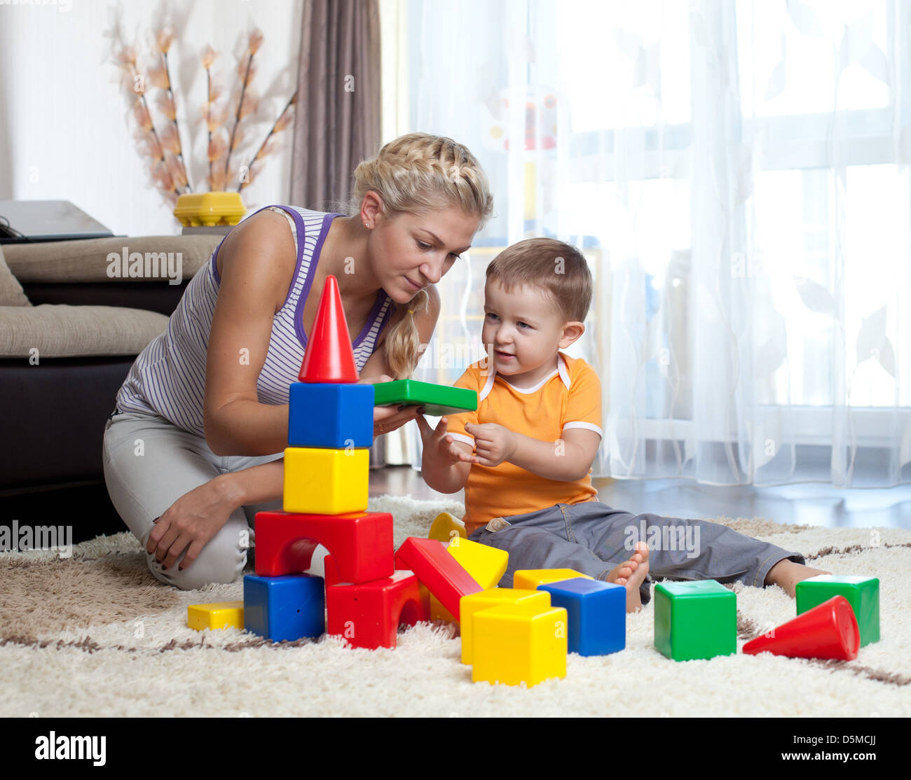 cute mother and child boy playing together indoor Stock Photo