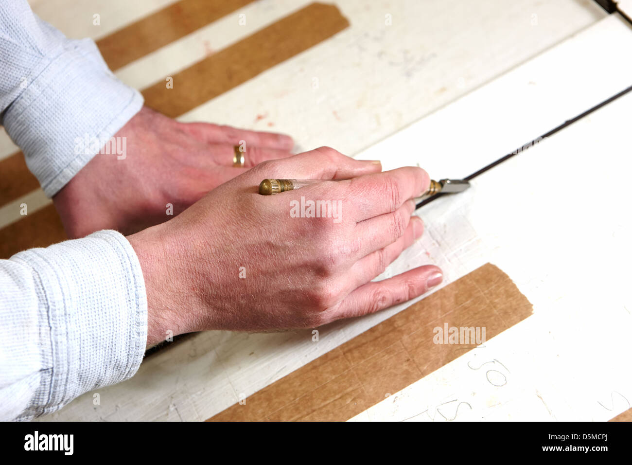 framer cutting glass by hand in a framing Stock Photo Alamy