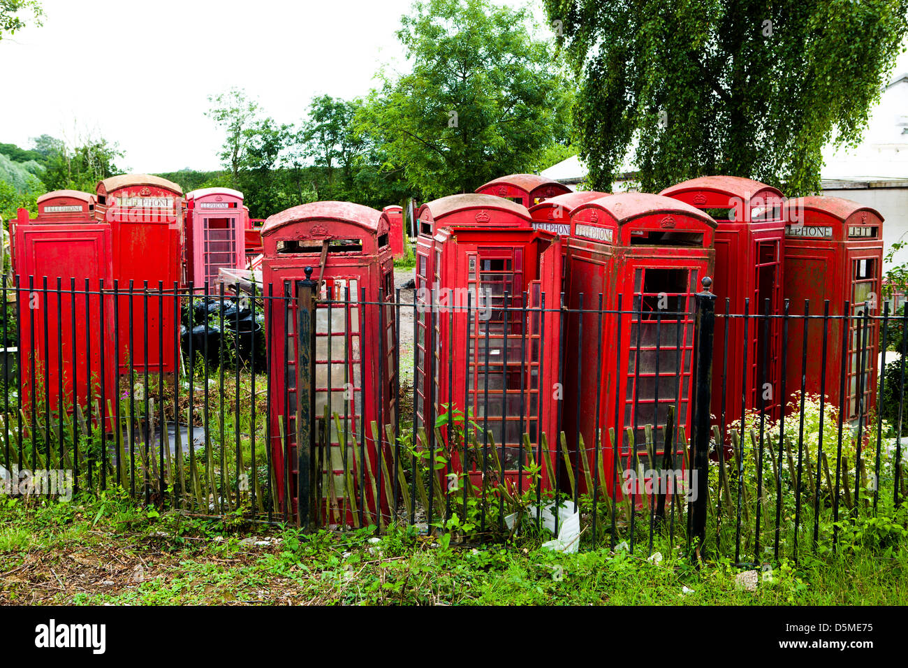 Red phonebox graveyard Stock Photo