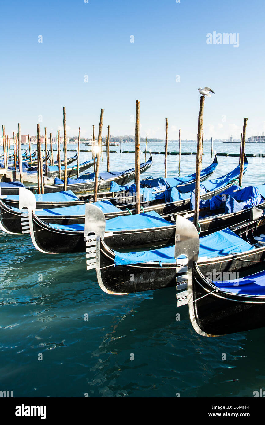 Gondolas moored by Saint Mark Square (Piazza San Marco). Stock Photo