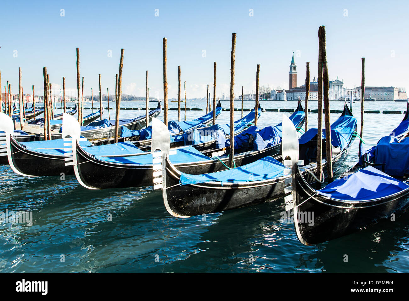 Gondolas moored by Saint Mark Square (Piazza San Marco). Stock Photo