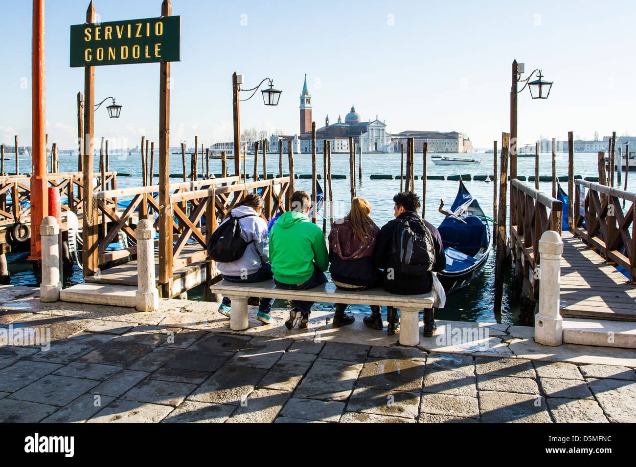 People waiting for gondola in front of Saint Mark Square (Piazza San Marco). Stock Photo