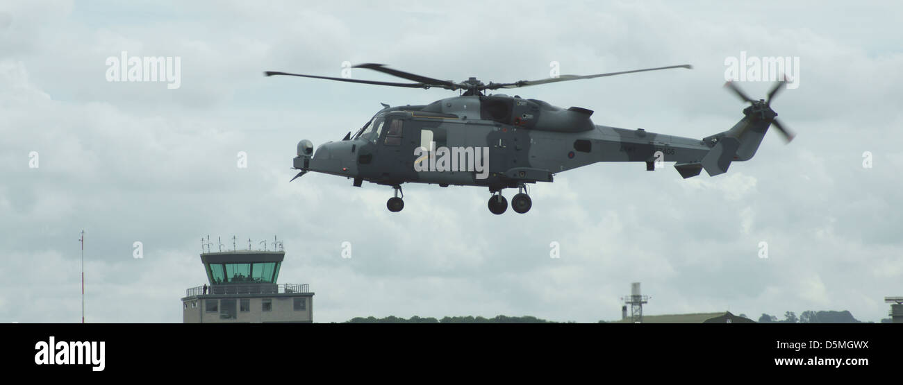 Royal Navy Army AgustaWestland future Lynx Wildcat AW159 helicopter hovering at an airshow on armed forces day Stock Photo