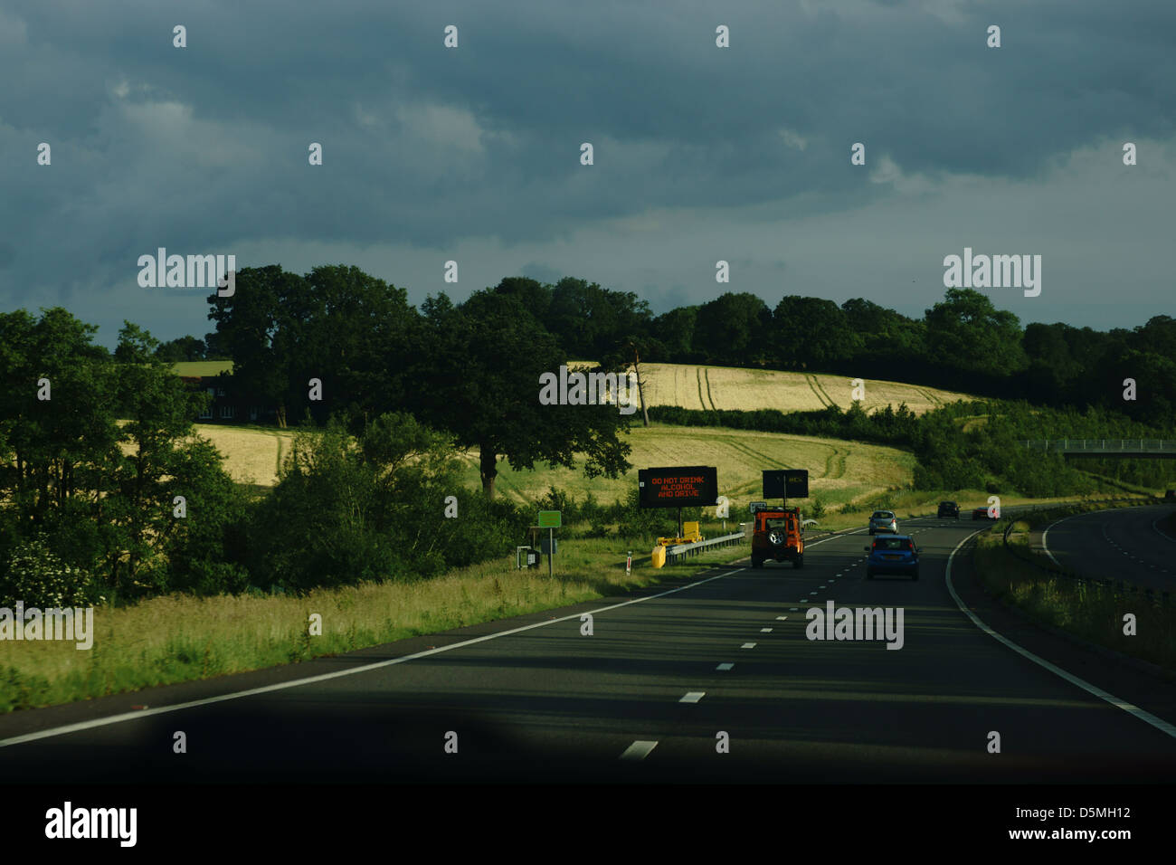 English country side motorway traffic  farm land Stock Photo