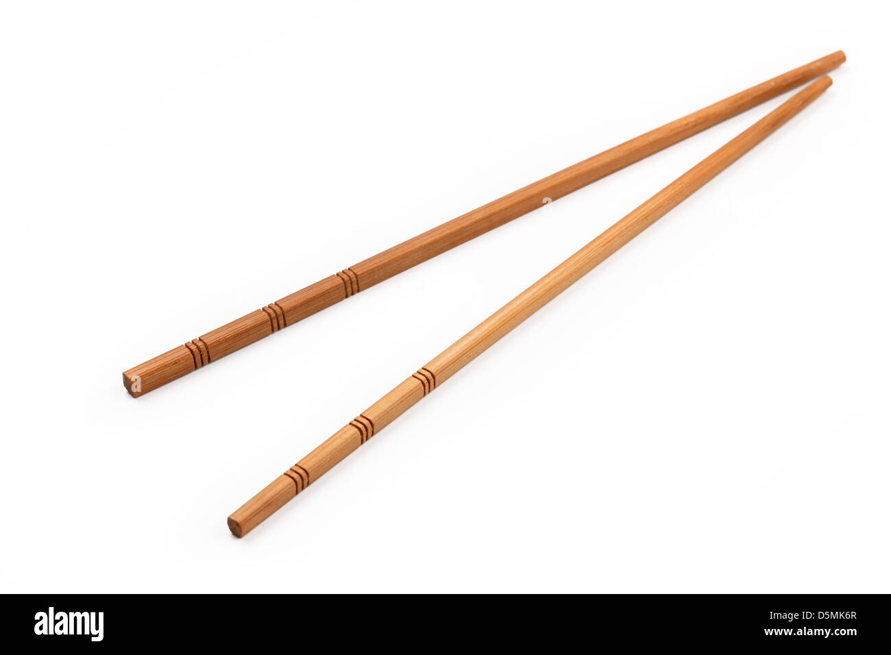 Wooden chopsticks, isolated on white background. Stock Photo