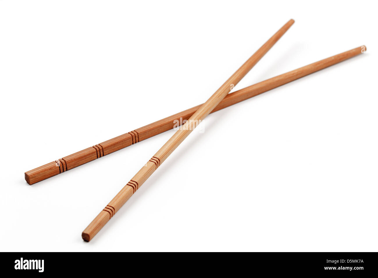 Wooden chopsticks, isolated on white background. Stock Photo