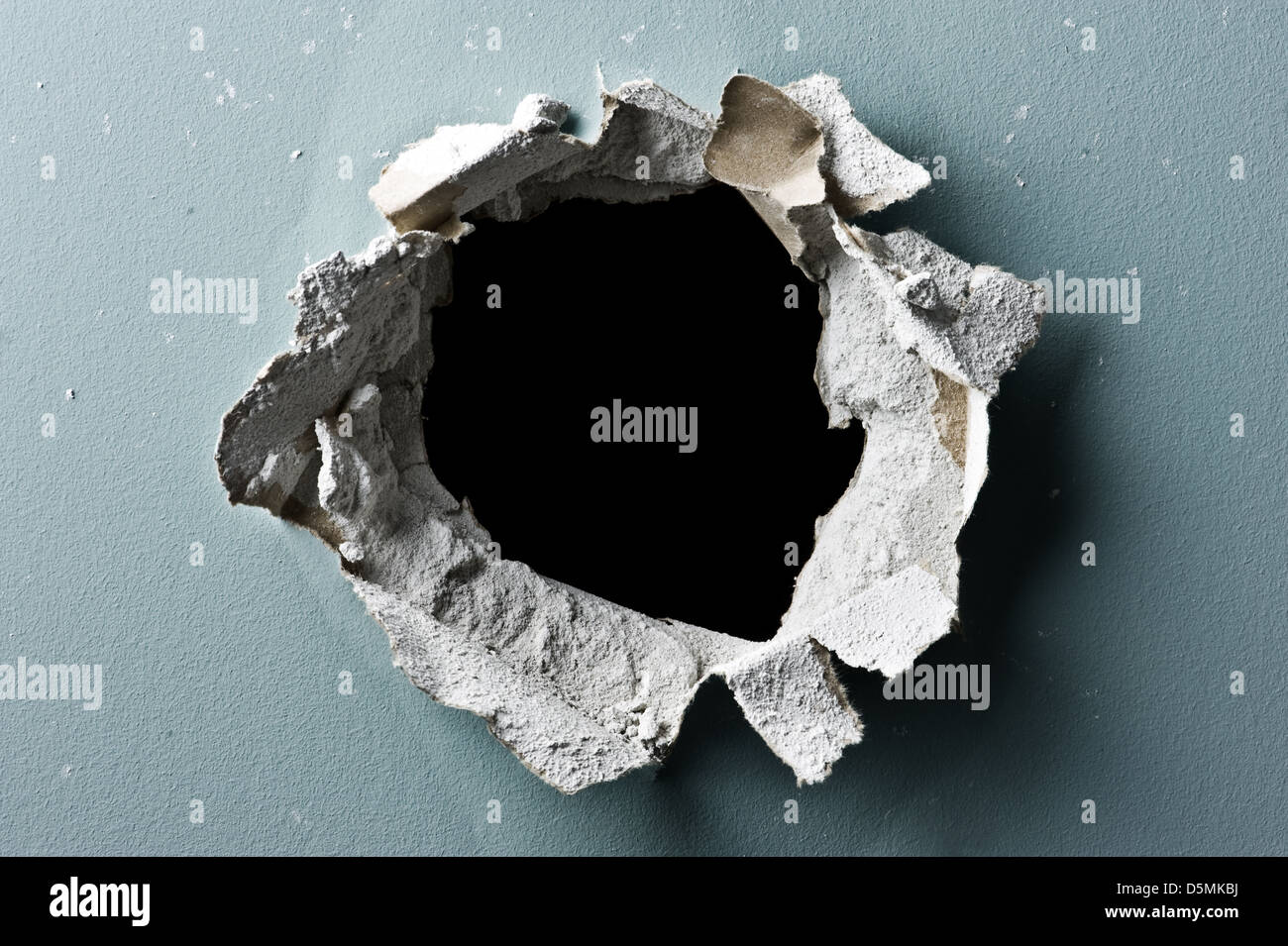 hole in concrete wall closeup Stock Photo