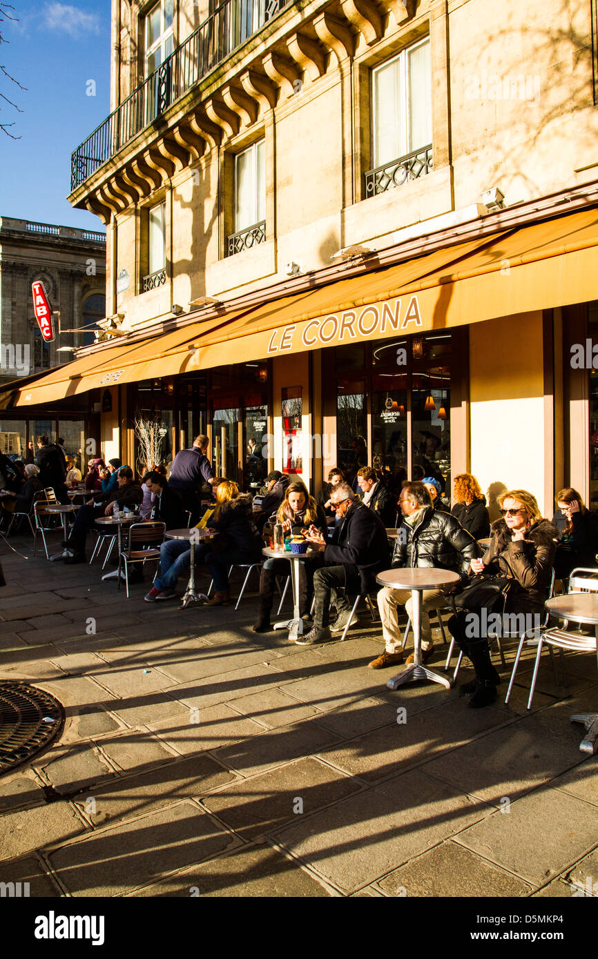Sidewalk cafe at Quai du Louvre. Stock Photo