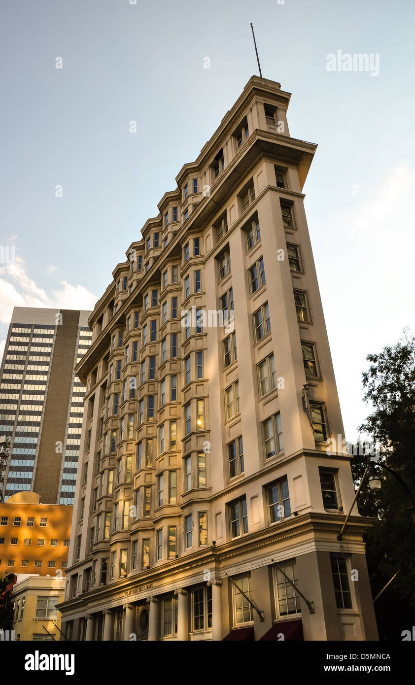 flat iron shaped building in a modern skyline Stock Photo