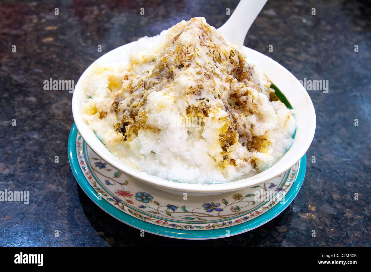 Cendol Shaved Ice Dessert with Gula Melaka Sugar Syrup and Coconut Milk Closeup Stock Photo