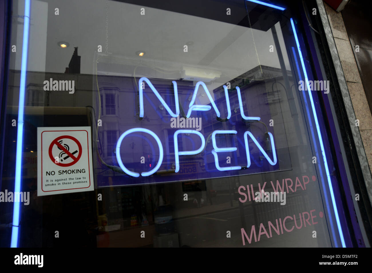 Nail Salon open sign in a shop window on Lewes Road in Brighton, East Sussex, UK. Stock Photo