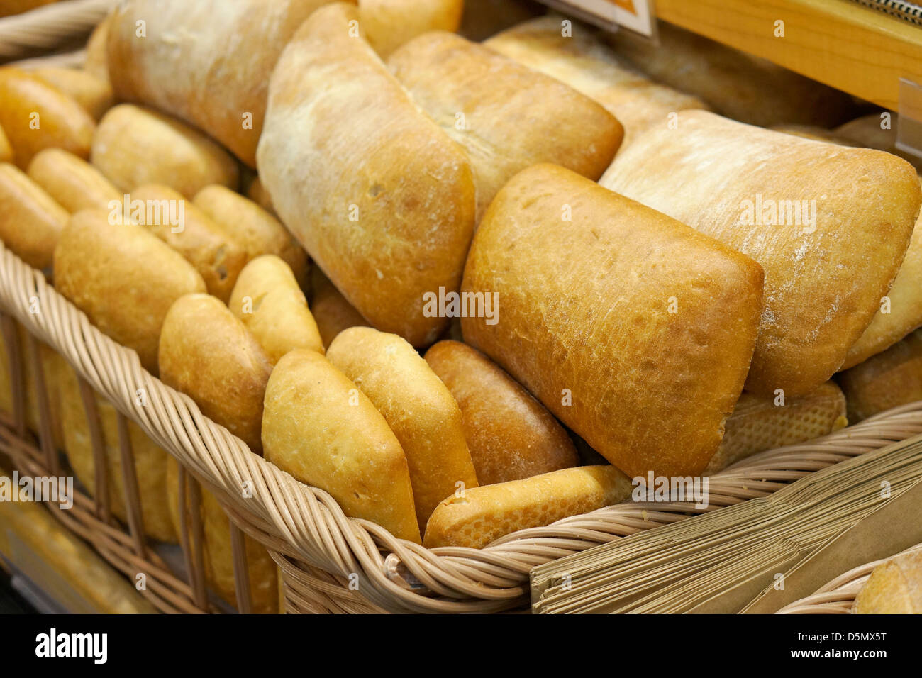 Ciabatta Bread, Loaves, Buns, Rolls of Bread in a Basket Stock Photo