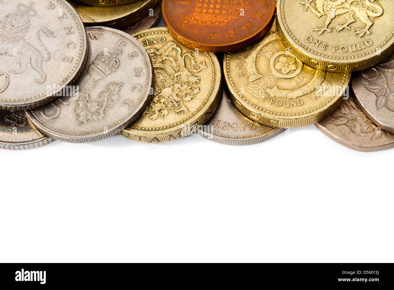 An edge of a pile of circulated British coins with white copy space at the bottom for text or graphics. Stock Photo