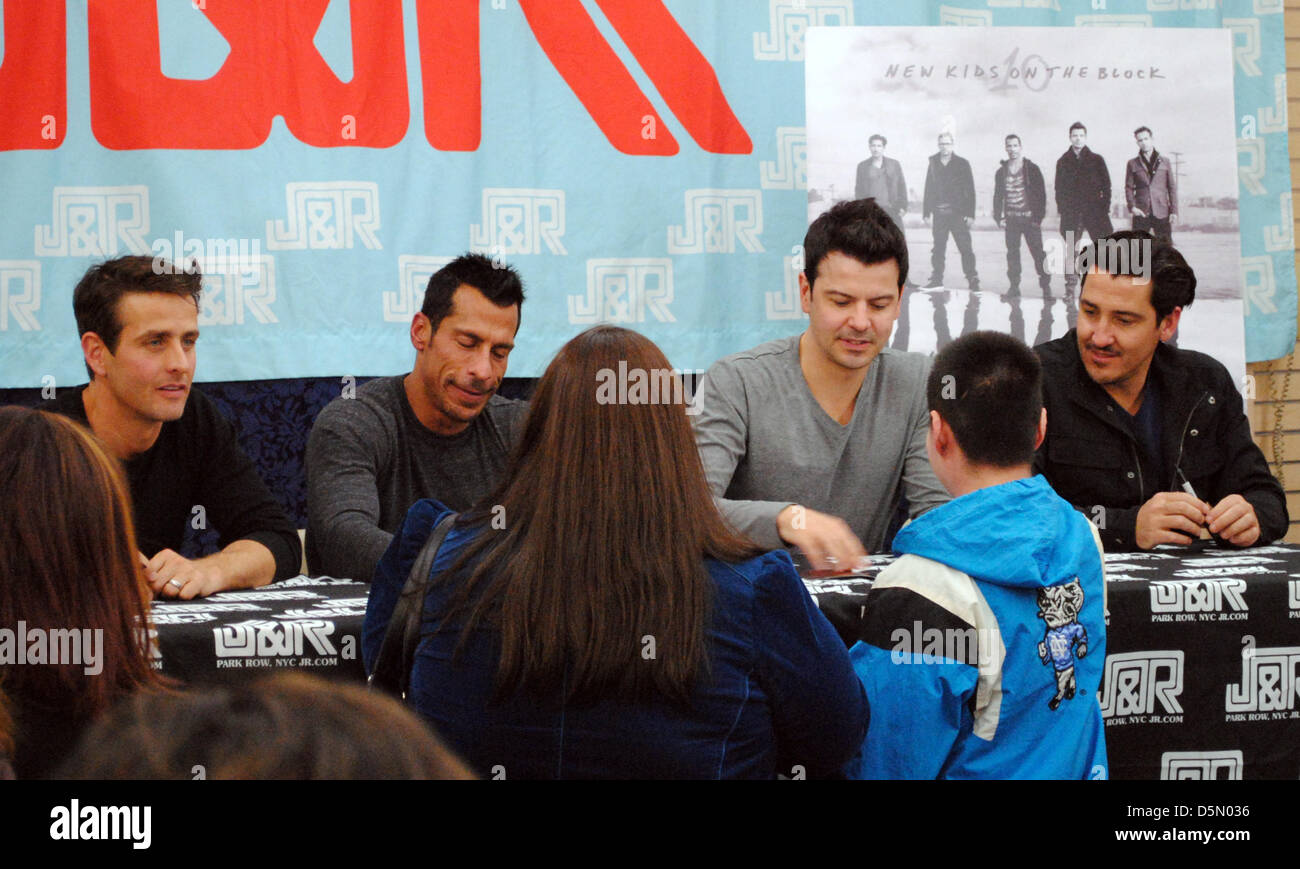 Joey McIntyre (l-r), Danny Wood, Jordan Knight and Jonathan Knight from American boyband New Kids on the Block sign autographs at 'J&R Music and Computer World' in New York, New York, USA, 02 April 2013. 25 years after ther hit debut, NKOTB is releasing a new album. Photo: CASPAR TOBIAS SCHLENK Stock Photo