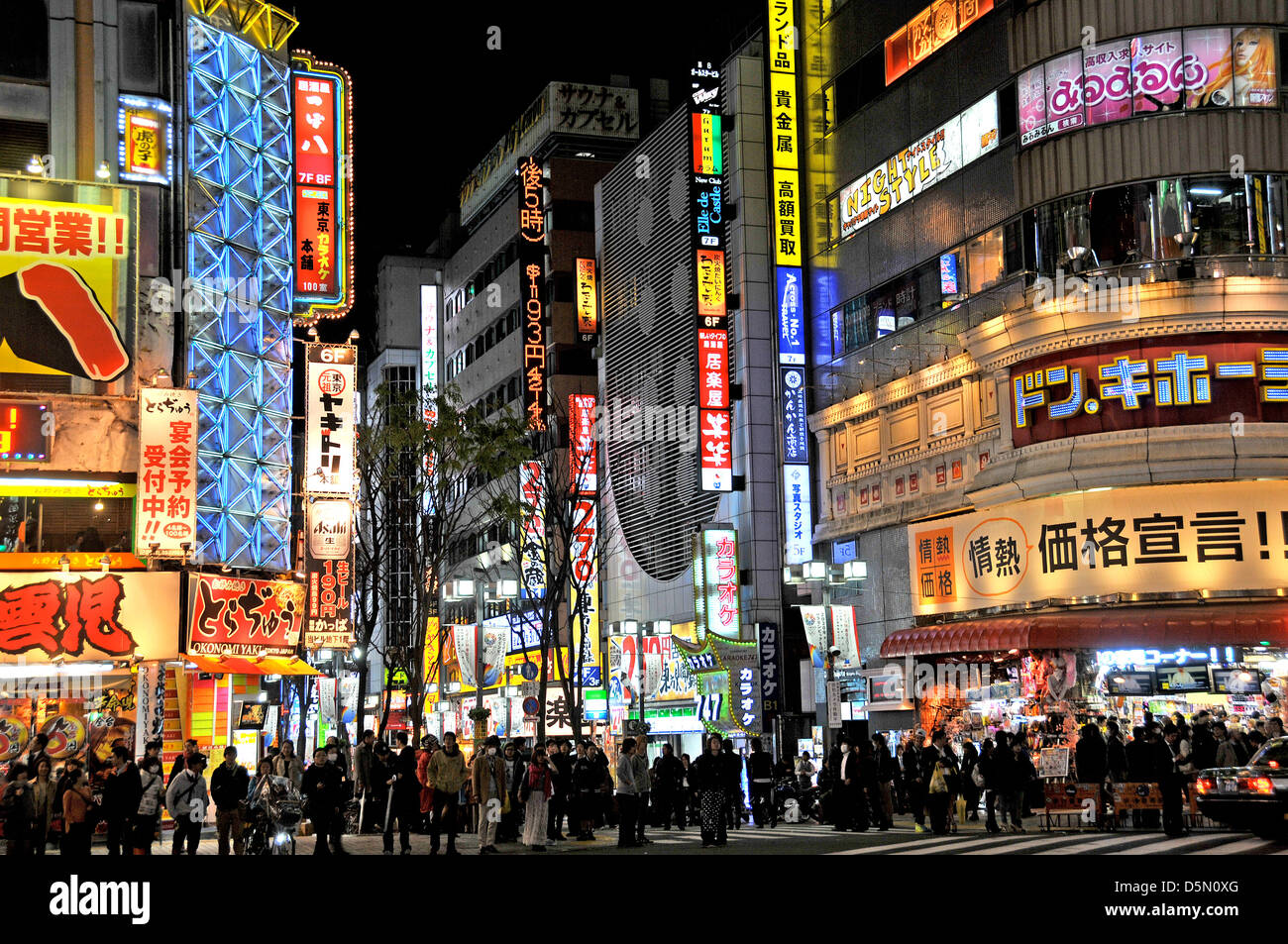 street scene by night Shinjuku Tokyo Japan Stock Photo