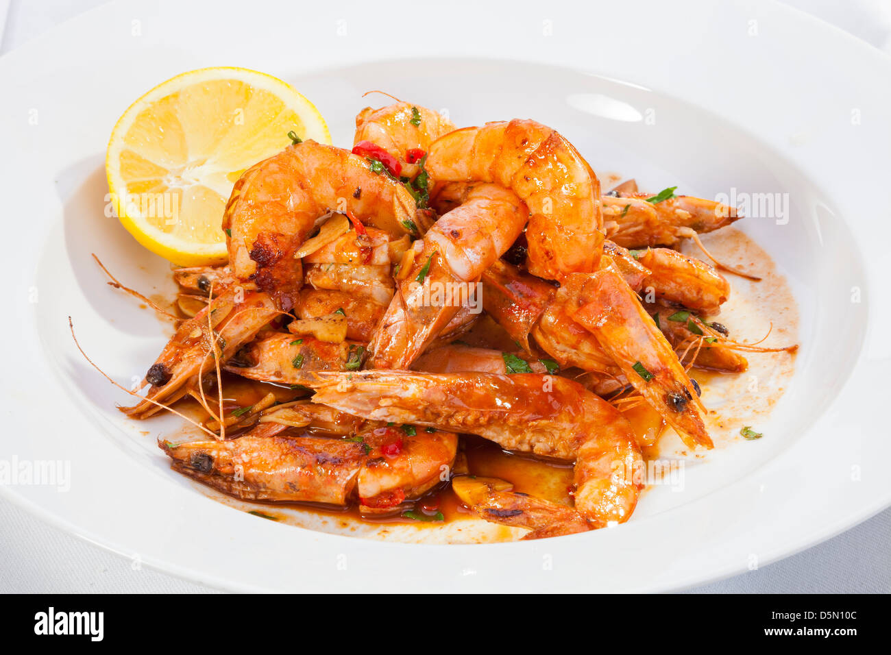 Shrimps prepared with garlic, chilli, white wine and balsamic vinegar Stock Photo