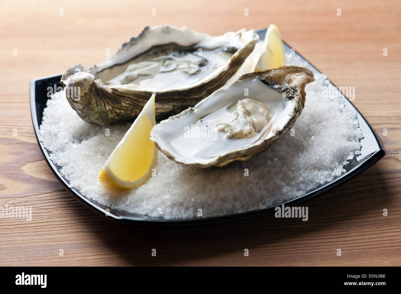 oysters with lemon close up Stock Photo