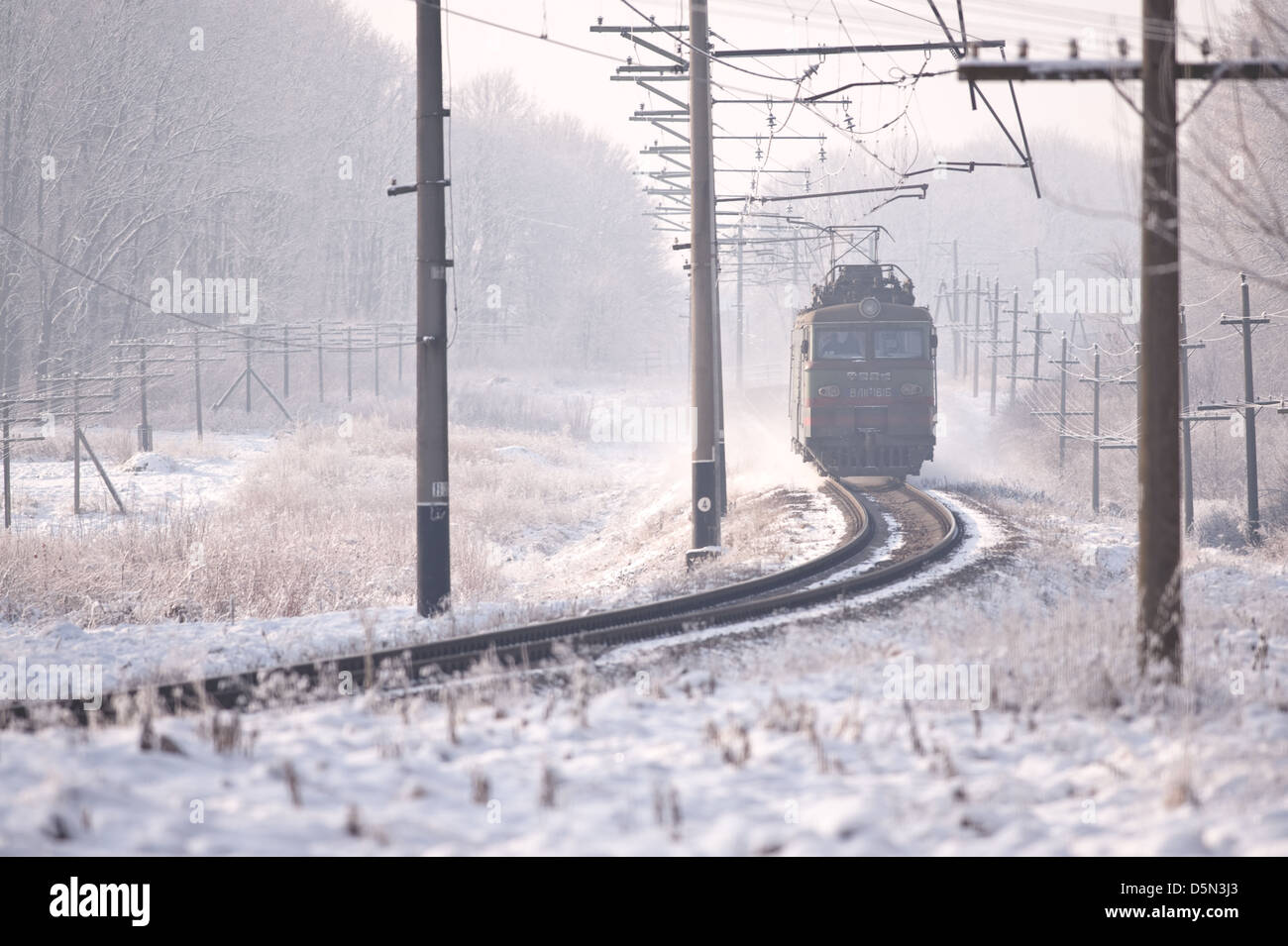 train on railway in winter time Stock Photo
