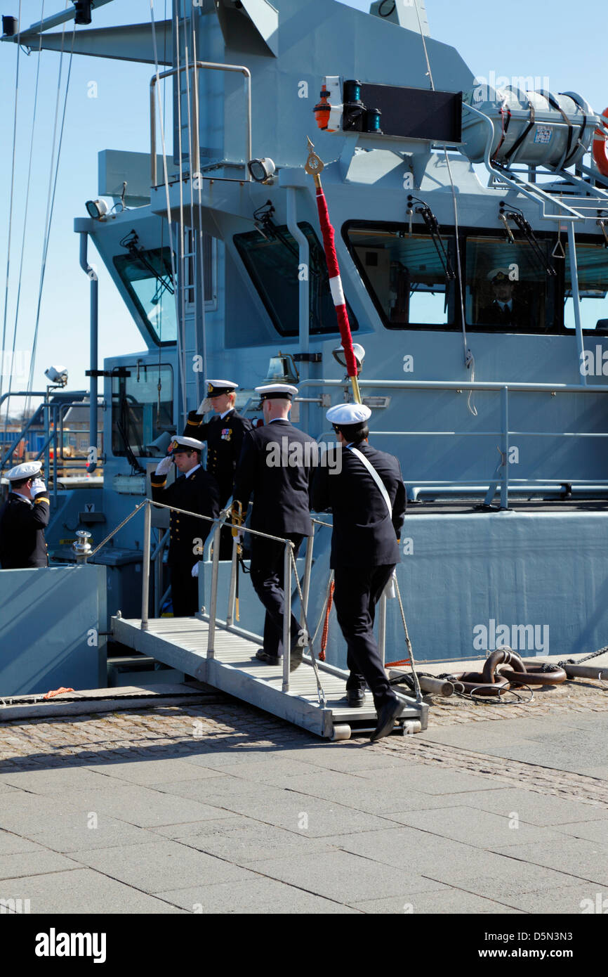 Copenhagen, Denmark. April 4th 2013. Cadets from the Royal Danish Naval Academy parade the flag on board the naval training ship Alholm after the traditional 'Flag on Board' parade through the city to mark the beginning of the new sailing season. Credit:  Niels Quist / Alamy Live News Stock Photo
