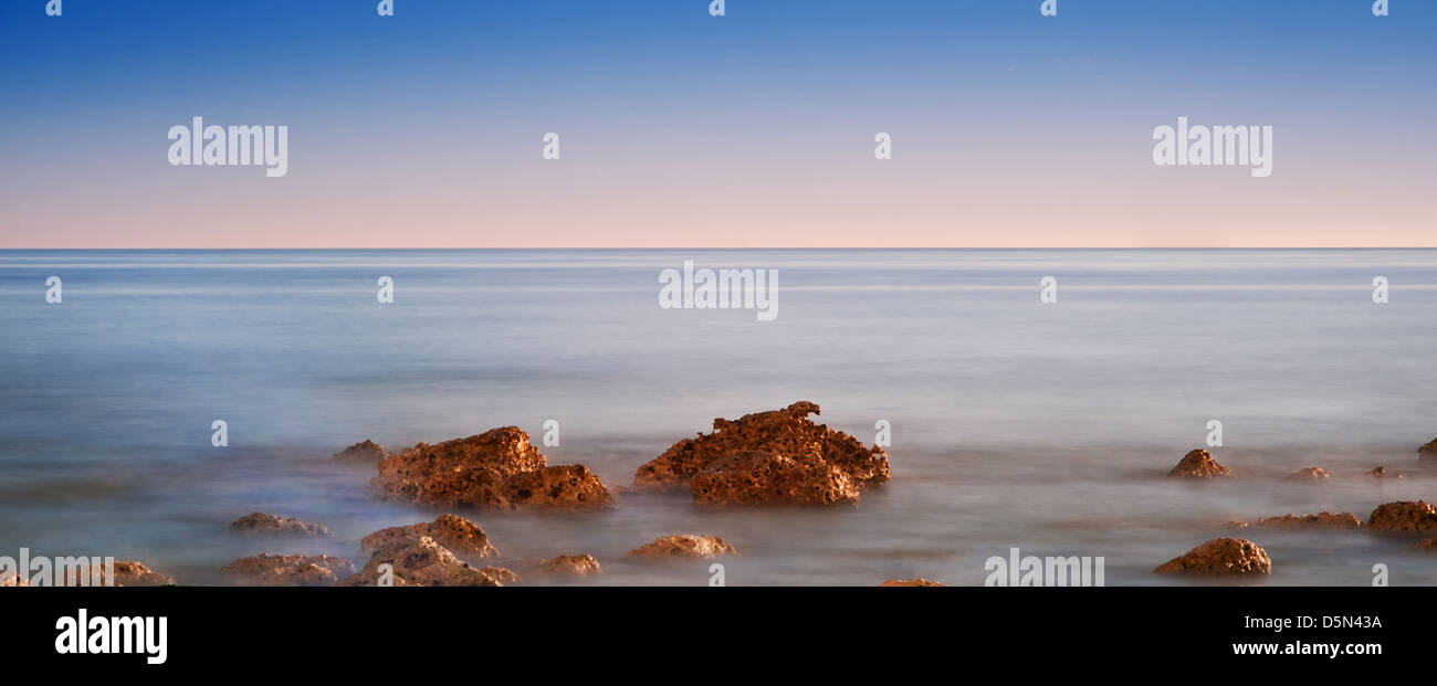 Stunning sunset over ocean waves hi-res stock photography and images ...