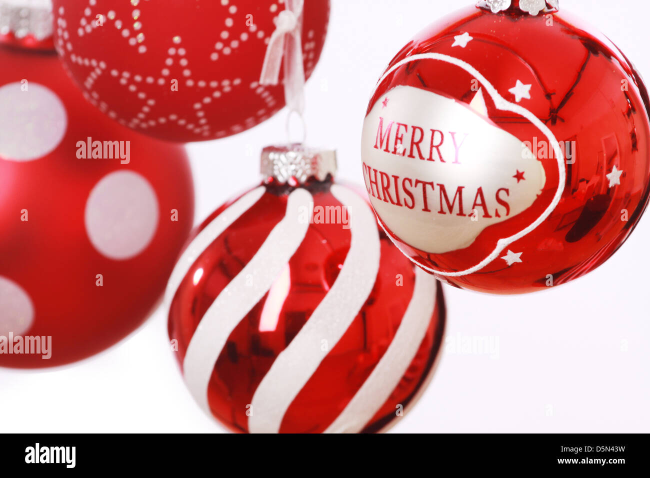 christmas bourball decorations in red and silver on white studio background Stock Photo