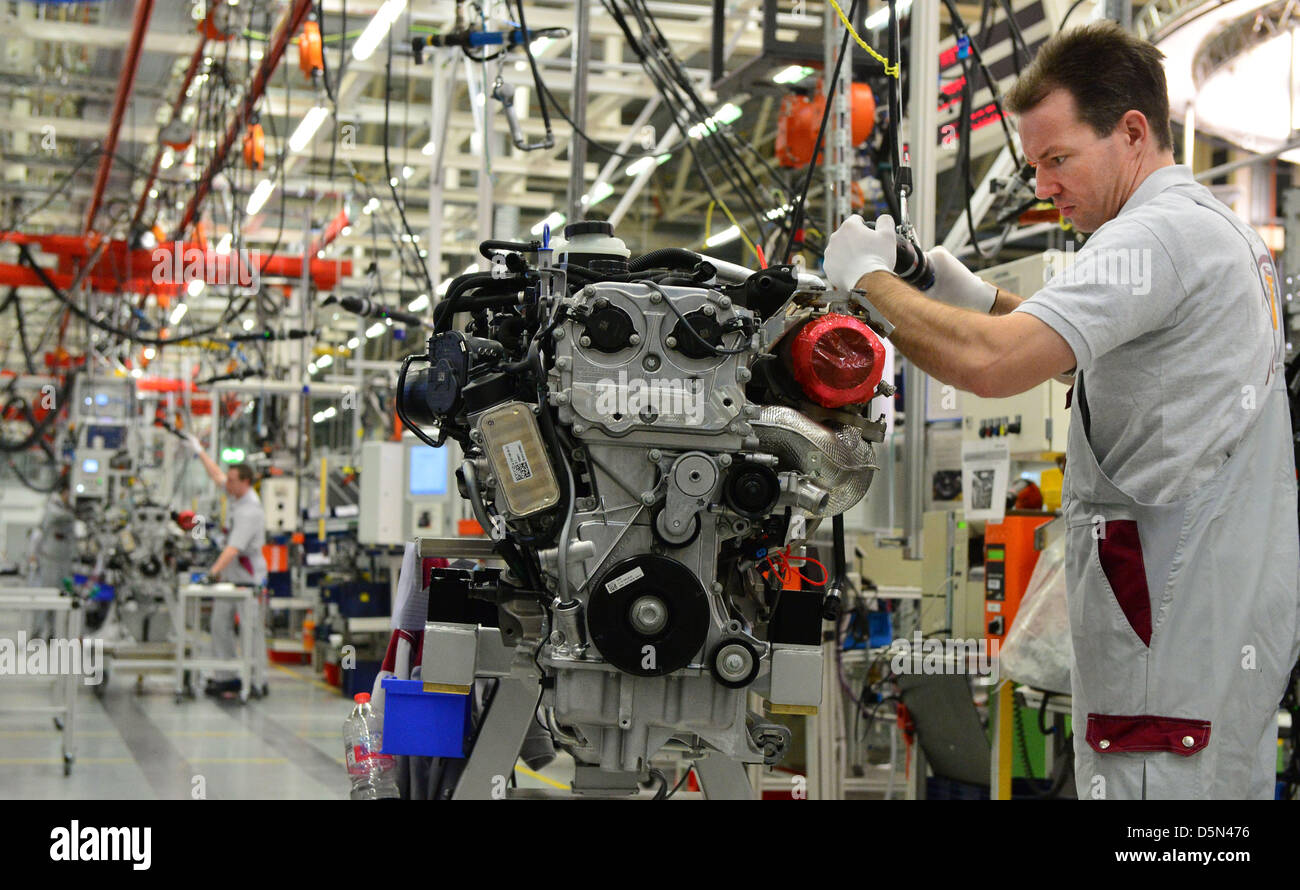 Kai Fischer assembles a petrol engine at the engine factory of the company MDC Power in Koelleda, Germany, 05 April 2013. On the same day, the production of the AMG 2,0-litre four-cylinder turbo engine started at the factory, where, according to Mercedes tradition, one mechanic assembles a whole engine. Photo: MARTIN SCHUTT Stock Photo