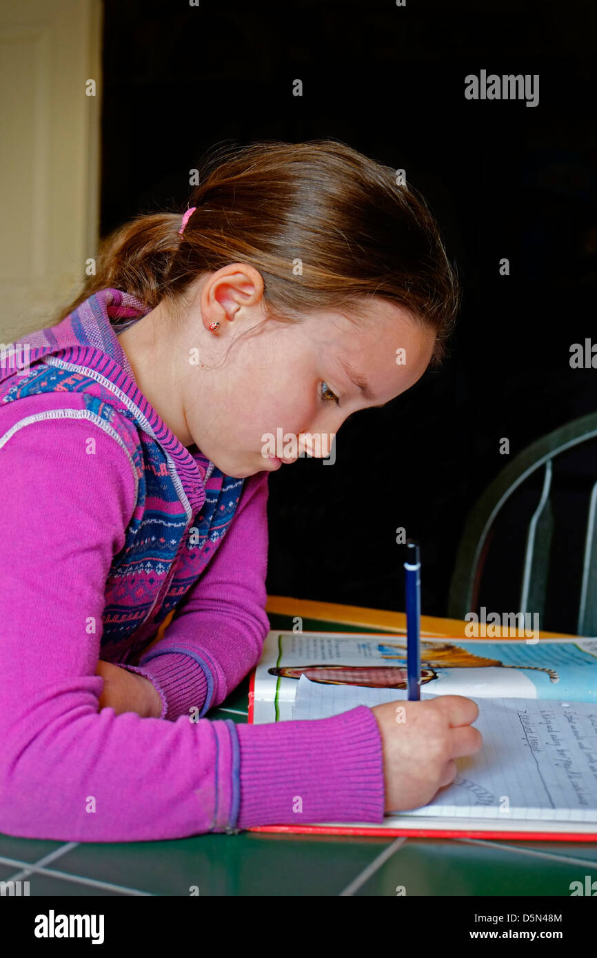 A young Girl doing Homework, Ireland Stock Photo