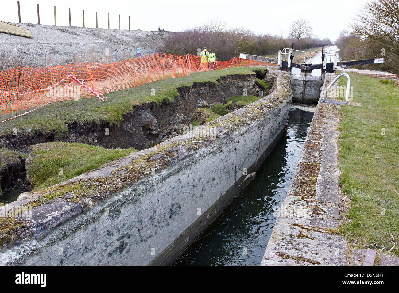 Canal & River Trust staff examine a collapsed lock on the Aylesbury Arm