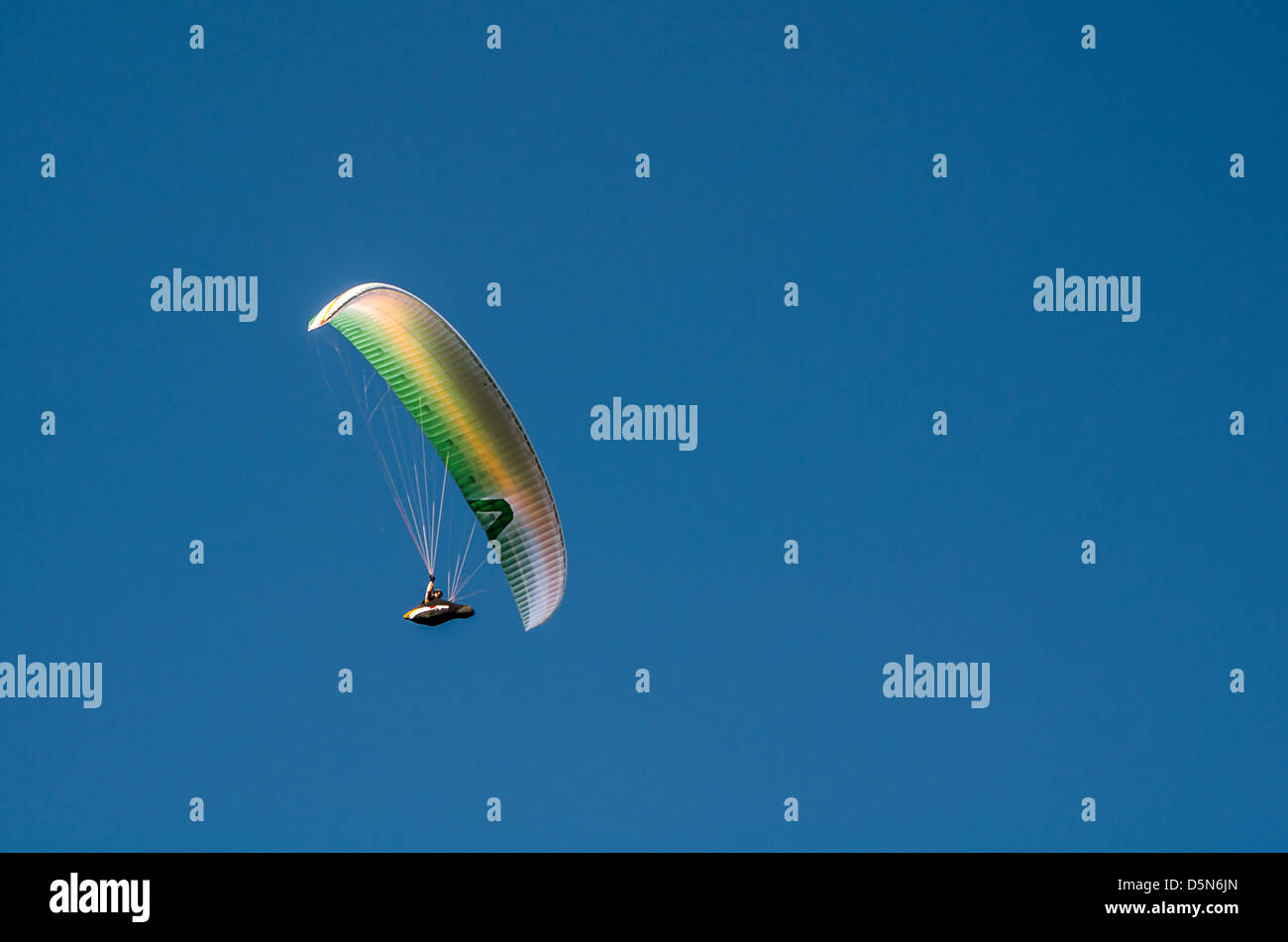 Hang gliding enthusiasts take the the skies creating a graceful spectacle at Stanwell Tops, Australia. Stock Photo