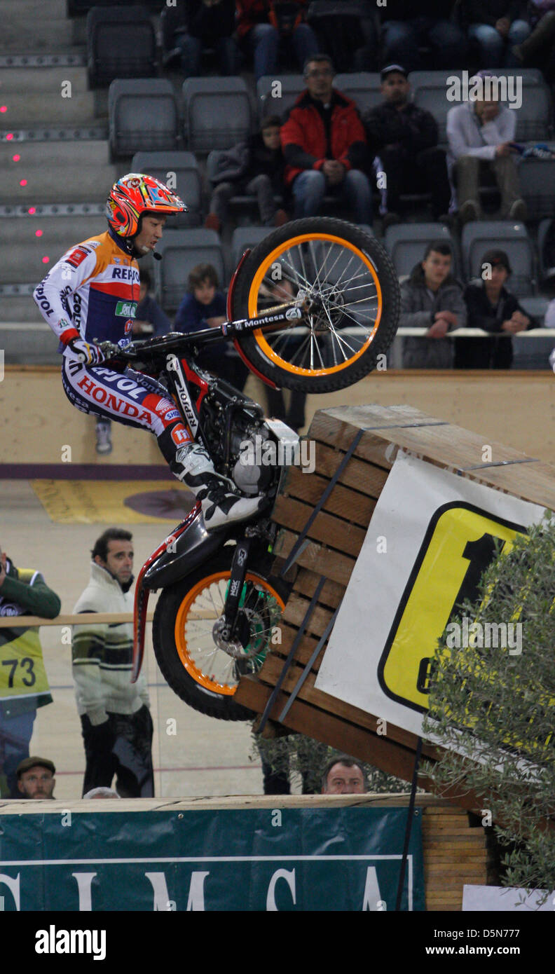A rider jumps over an obstacle during a stage of the world Trial ...