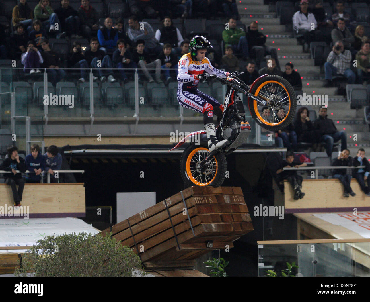 A rider jumps over an obstacle during a stage of the world Trial ...