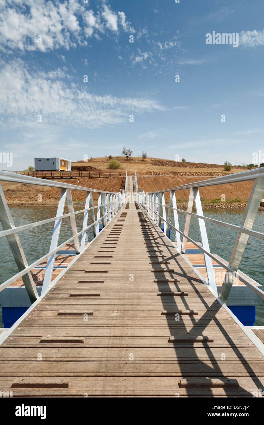 Wooden walkway serving Amieira pier on the banks of the reservoir of Alqueva, Alentejo, Portugal Stock Photo