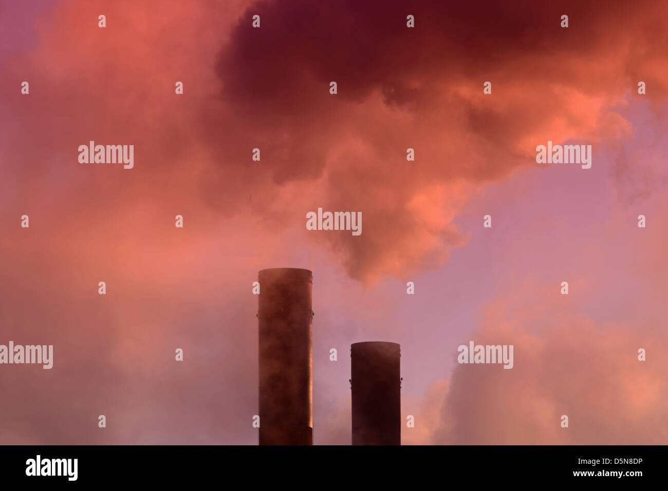 smoke billowing from ferrybridge power station chimney at sunrise United Kingdom Stock Photo